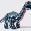 Peluche de dinosaurio con lentejuelas reversibles. Color azul y morado.