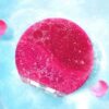 Cepillo exfoliante facial de silicona eléctrico color fucsia