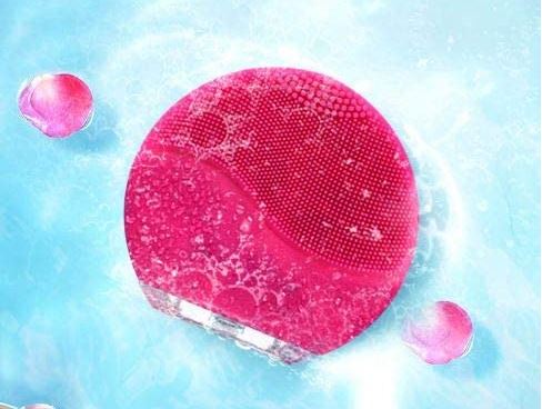 Cepillo exfoliante facial de silicona eléctrico color fucsia